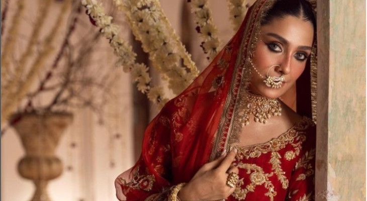 Elegance oozes from Ayeza Khan in red bridal jora