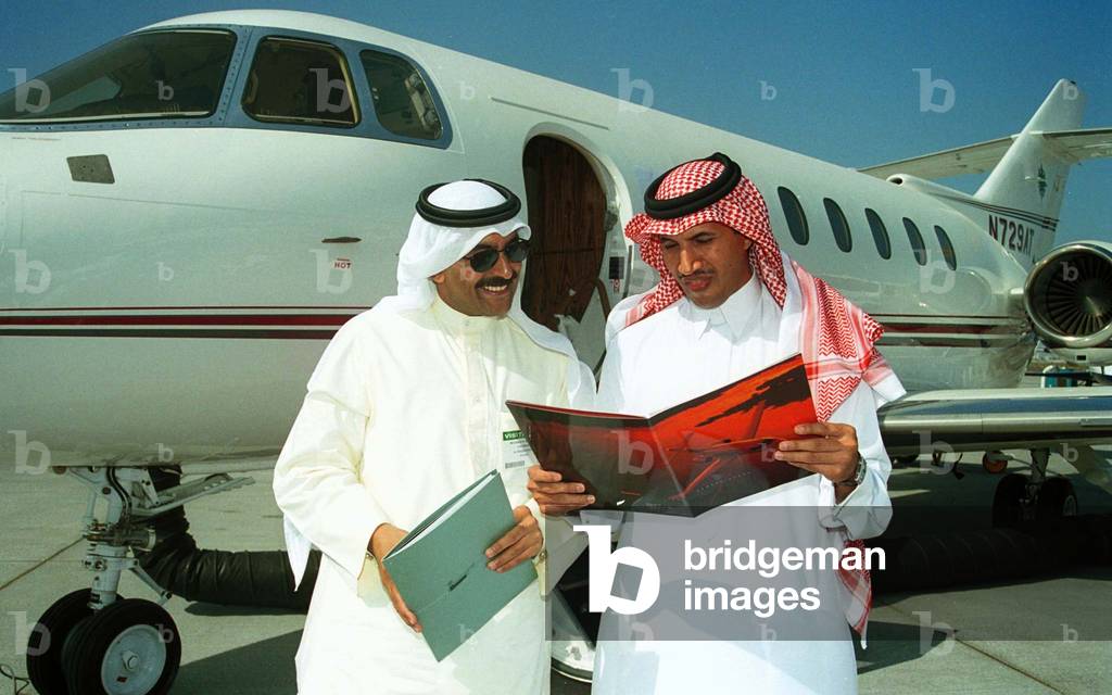 Image of ABDULAZIZ AL-MAYOUF AND HAMAD AL WAZZAN IN FRONT OF RAYTHEON